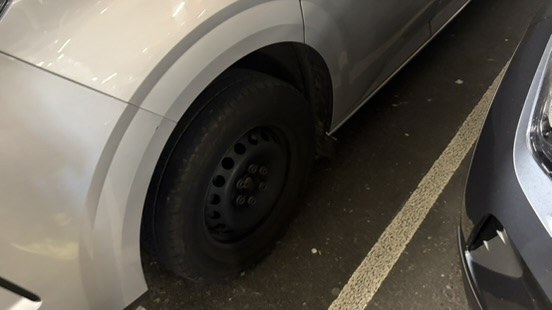 The other front wheel, also with no hubcap fitted
